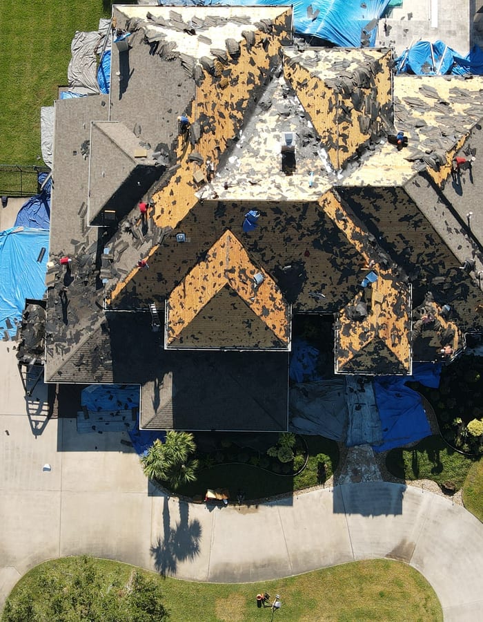 Roofing crew documenting installation work on a residential project